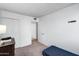 Clean bedroom featuring neutral carpet, white walls and closet at 1032 E Redfield Rd, Tempe, AZ 85283
