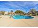 Large community pool with ample seating and landscaping for relaxation and recreation at 1032 E Redfield Rd, Tempe, AZ 85283