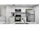 Updated kitchen with stainless steel appliances, modern cabinets, and granite countertops at 1032 E Redfield Rd, Tempe, AZ 85283