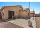 Back of the house shows the patio, yard, and the home's architectural style at 10646 E Enid Ave, Mesa, AZ 85208