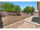 Expansive backyard with stone details and mature trees and landscaping at 10646 E Enid Ave, Mesa, AZ 85208