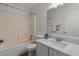Clean bathroom featuring a shower-tub combo and a vanity with modern fixtures at 10646 E Enid Ave, Mesa, AZ 85208