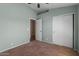 Bedroom with neutral walls and carpet, and en suite access at 10646 E Enid Ave, Mesa, AZ 85208