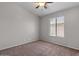 Bedroom featuring a window and wall to wall carpeting at 10646 E Enid Ave, Mesa, AZ 85208