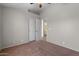 Neutral bedroom features carpet, a ceiling fan, and access to the ensuite bathroom at 10646 E Enid Ave, Mesa, AZ 85208