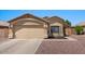 Charming single-story home with a two-car garage and well-maintained landscaping at 10646 E Enid Ave, Mesa, AZ 85208
