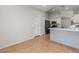 Bright kitchen area with tan tiled flooring and grey accent walls at 10646 E Enid Ave, Mesa, AZ 85208