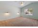 Spacious main bedroom featuring shiplap accent wall and modern ceiling fan at 10646 E Enid Ave, Mesa, AZ 85208