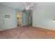 Large main bedroom with neutral carpet, ceiling fan, and en-suite access at 10646 E Enid Ave, Mesa, AZ 85208