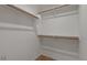 Walk-in closet with wood railings and ample storage space at 10646 E Enid Ave, Mesa, AZ 85208