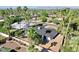 Expansive aerial view of home with mature landscaping, a block fence, and a view of the mountains in the distance at 10844 N 37Th Way, Phoenix, AZ 85028
