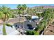 An aerial view of the house, palm trees, and mountains at 10844 N 37Th Way, Phoenix, AZ 85028