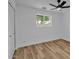 A bedroom features wood-look floors, a ceiling fan and closet at 10844 N 37Th Way, Phoenix, AZ 85028