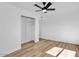 Bright and airy bedroom featuring hardwood floors and a ceiling fan at 10844 N 37Th Way, Phoenix, AZ 85028