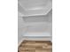 Walk-in closet showcasing built-in shelving and ample storage space at 10844 N 37Th Way, Phoenix, AZ 85028