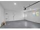 Spacious and clean garage interior with multiple doors and natural light at 10844 N 37Th Way, Phoenix, AZ 85028