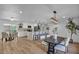Bright, open kitchen features white cabinets, stainless appliances, a large island, and modern pendant lighting at 10844 N 37Th Way, Phoenix, AZ 85028