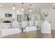 Modern kitchen with white cabinetry, stainless steel appliances, and stylish pendant lighting over the breakfast bar at 10844 N 37Th Way, Phoenix, AZ 85028