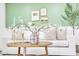 Close-up showcasing decorative details in the living room, including floral arrangement, artwork and a comfortable sofa at 10844 N 37Th Way, Phoenix, AZ 85028