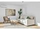 Cozy living room showing neutral tones, modern art, and plenty of natural light at 10844 N 37Th Way, Phoenix, AZ 85028