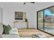 Inviting living room featuring sliding glass doors to a patio and wood floors at 10844 N 37Th Way, Phoenix, AZ 85028