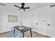 Contemporary office with black desk, modern decor and ceiling fan at 10844 N 37Th Way, Phoenix, AZ 85028