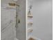 Modern shower featuring a rainfall shower head and marble tiling at 10844 N 37Th Way, Phoenix, AZ 85028