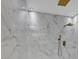 Luxurious shower with marble tiling, sleek fixtures, and modern design at 10844 N 37Th Way, Phoenix, AZ 85028