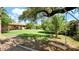 Lush backyard features beautiful mature trees and an idyllic swing set at 11011 N 39Th St, Phoenix, AZ 85028