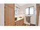 Bathroom showcasing vanity with storage, an ornate mirror, and natural light at 11011 N 39Th St, Phoenix, AZ 85028