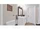 Bathroom with white vanity, tile floors, and well lit mirror at 11011 N 39Th St, Phoenix, AZ 85028