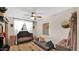 Well lit Bedroom with dark wood floors and neutral colors with a crib and sofa at 11011 N 39Th St, Phoenix, AZ 85028