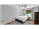 Cozy bedroom with hardwood floors, ceiling fan, and natural light from the window at 11011 N 39Th St, Phoenix, AZ 85028
