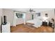 Cozy bedroom featuring hardwood floors, a ceiling fan, and a window for natural light at 11011 N 39Th St, Phoenix, AZ 85028