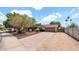 Well-maintained home featuring mature trees, low-maintenance landscaping, and an inviting front entryway at 11011 N 39Th St, Phoenix, AZ 85028