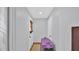 Hallway with neutral paint leads to rooms and front door with natural light at 11011 N 39Th St, Phoenix, AZ 85028