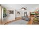 A living room featuring hardwood floors, modern art, and stylish decor with seamless access to the kitchen area at 11011 N 39Th St, Phoenix, AZ 85028