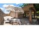 Outdoor patio seating area with a large umbrella, perfect for relaxing and enjoying the backyard view at 11011 N 39Th St, Phoenix, AZ 85028