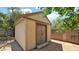 Exterior view of a well-maintained backyard storage shed, offering ample space for tools and equipment at 11011 N 39Th St, Phoenix, AZ 85028