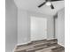 Bright bedroom with wood-look floors featuring a ceiling fan, closet and neutral colors at 1180 W Rosal Ave, Apache Junction, AZ 85120