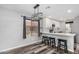 Eat-in kitchen area with modern light fixture, gray walls, and breakfast bar seating at 1180 W Rosal Ave, Apache Junction, AZ 85120