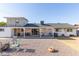 Backyard showcasing a covered patio and offering plenty of space for relaxation at 1235 E Dover St, Mesa, AZ 85203