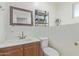 Bright bathroom featuring a vanity with a modern faucet and a large mirror at 1235 E Dover St, Mesa, AZ 85203