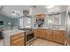Modern kitchen with a gas range, ample cabinet space, and stylish countertops at 1235 E Dover St, Mesa, AZ 85203