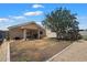 View of the backyard with block wall and patio with room for entertaining at 12410 W Flores Dr, El Mirage, AZ 85335