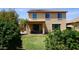 Spacious backyard with green grass, a covered patio, and well-maintained landscaping at 1309 W Park St, Phoenix, AZ 85041