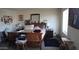 A bedroom with a wooden bed frame, cluttered furniture, and soft lighting at 1309 W Park St, Phoenix, AZ 85041