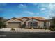 Charming single-story home with a two-car garage, stylish stone accents, and well-maintained landscaping at 1420 E Edwin St, Casa Grande, AZ 85122