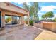 Back patio with stone flooring, exterior fan, and outdoor grill; great for entertaining at 15101 W Waterford Dr, Surprise, AZ 85374