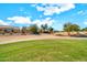 View of the backyard from the golf course at 15101 W Waterford Dr, Surprise, AZ 85374